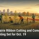 Fostoria News Community members planting trees at urban prairie event in Fostoria.